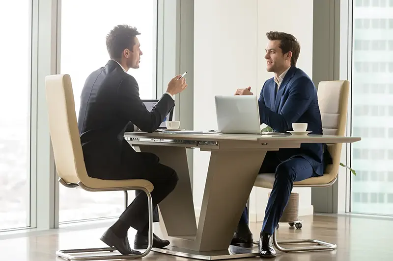 two coworkers having a conversation